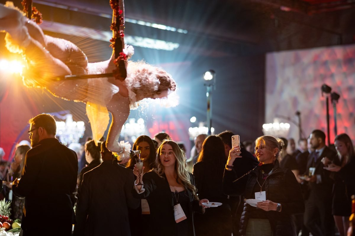Aerial acrobat performing above a crowd, filmed by Illumino Media
