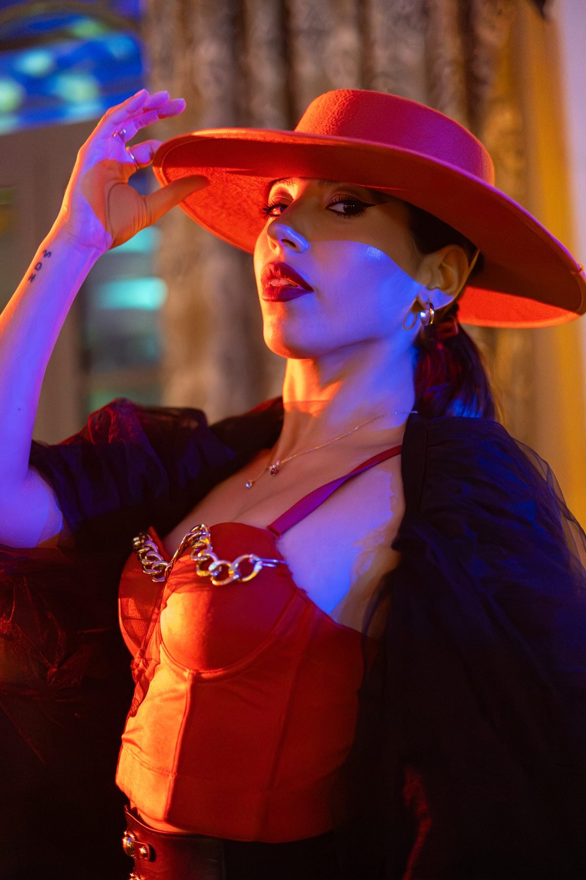 Cinematic portrait in a red hat, photographed by Illumino Media