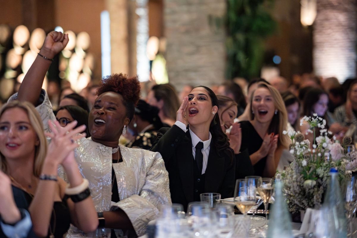 Guests celebrating at a candlelit gala, filmed by Illumino Media